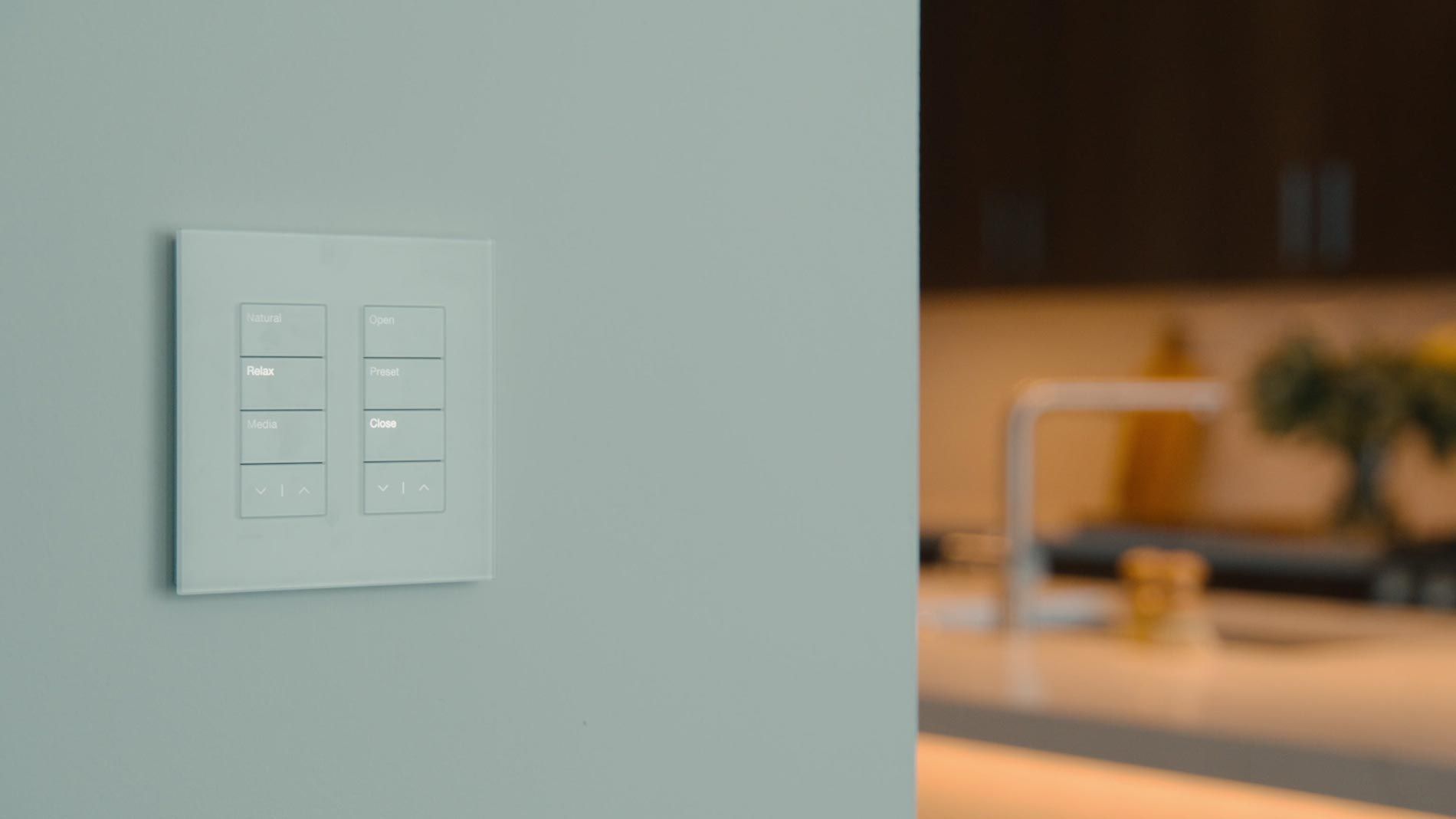 Smart wall control panel in a modern kitchen
