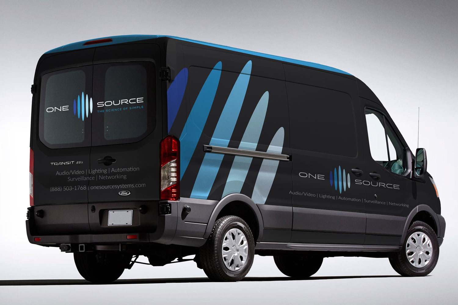Vehicle wrap and signage graphics extending a security company brand across its service area
